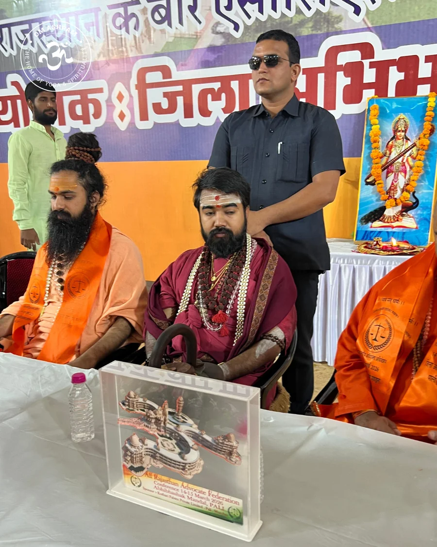 Glass OM Ashram model gift presented at the 2026 Legal Convention.